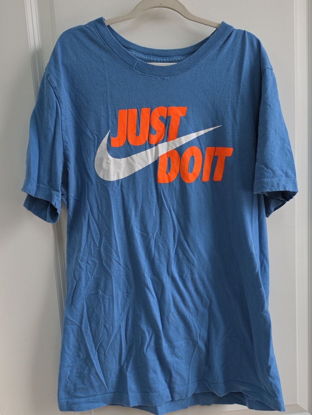 Nike Men’s Blue Short-Sleeve Tee with Orange "JUST DO IT" and White Swoosh